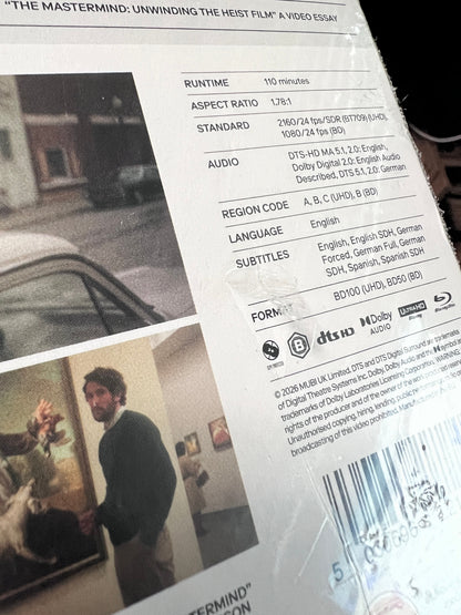 Gouges on back slipcover of Damaged | The Mastermind (UK Import) [4K Ultra HD]
