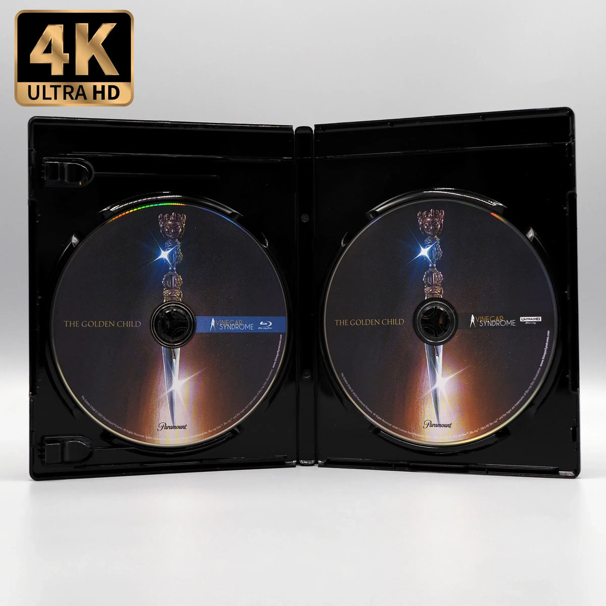 Open case showing discs of The Golden Child [4K Ultra HD + Blu-ray Set]