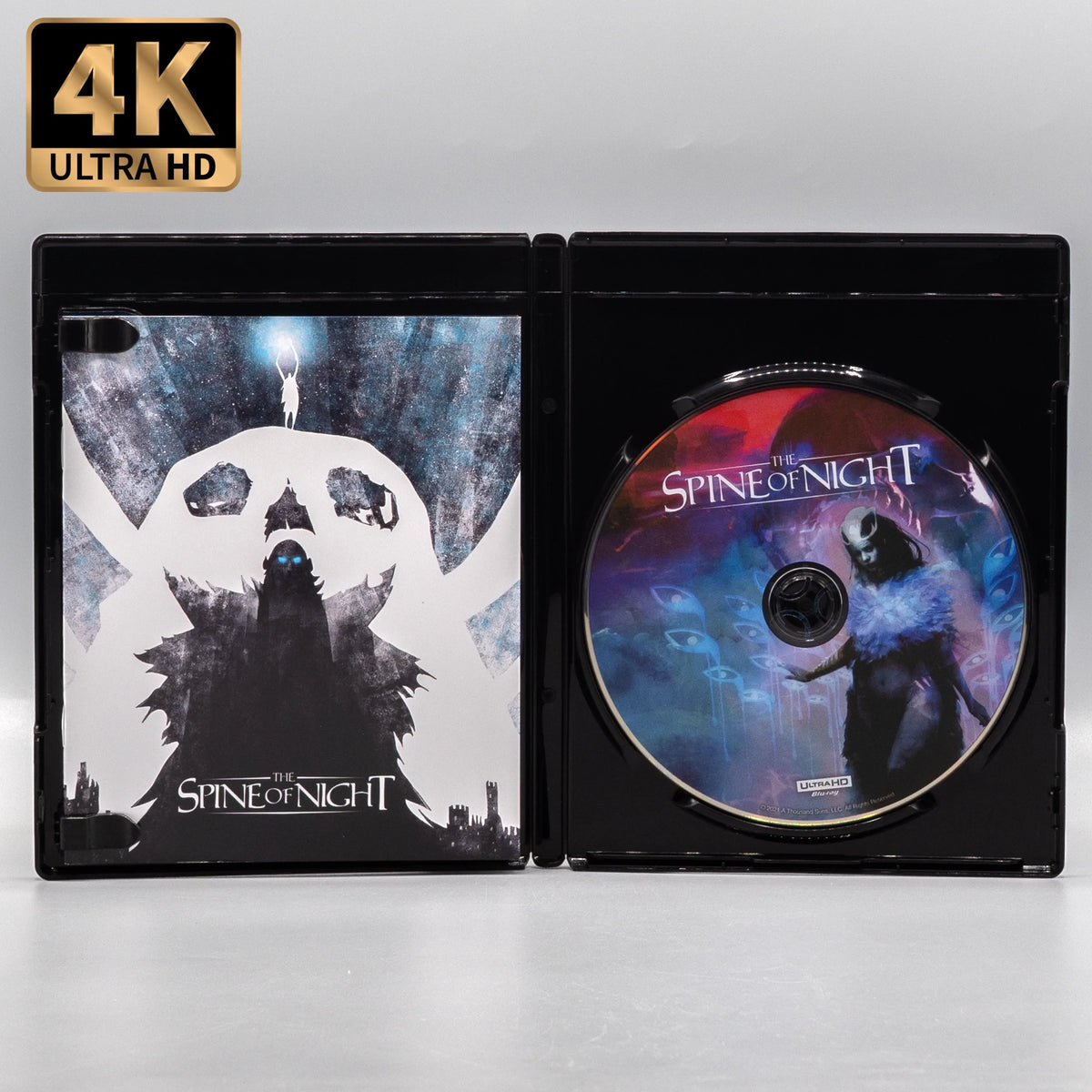 Open case showing disc art of The Spine of Night [4K Ultra HD + Blu-ray]