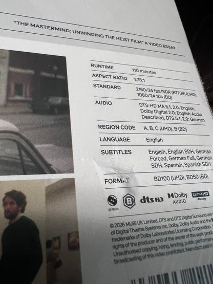 Gouges on back slipcover of Damaged | The Mastermind (UK Import) [4K Ultra HD]