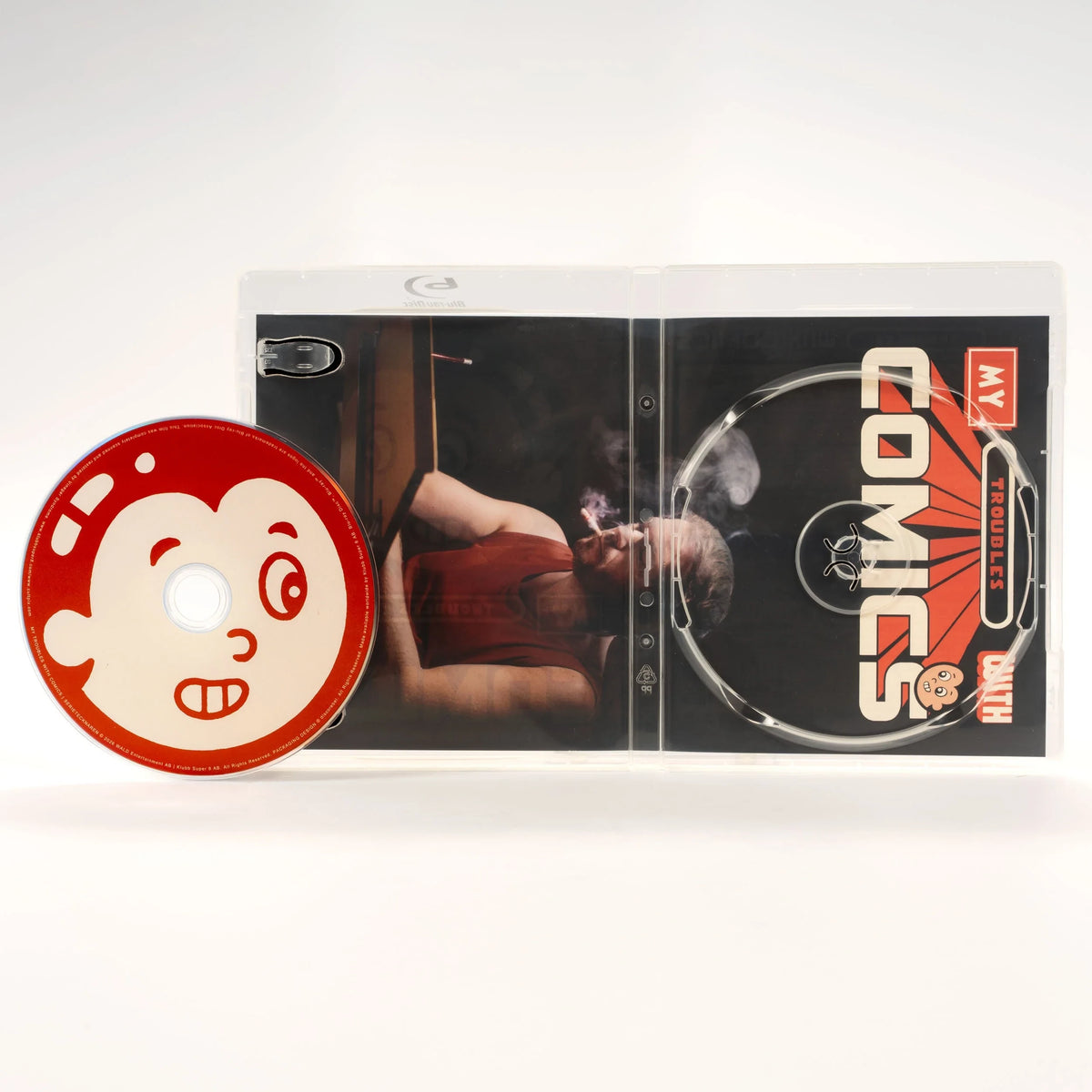 Open case showing disc art of My Troubles with Comics [Blu-ray]